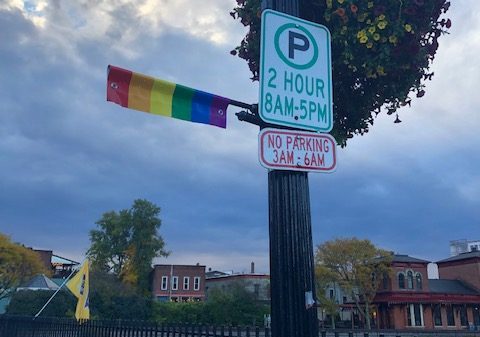 One of the pride flag banners on the Main Street bridge shown vandalized.