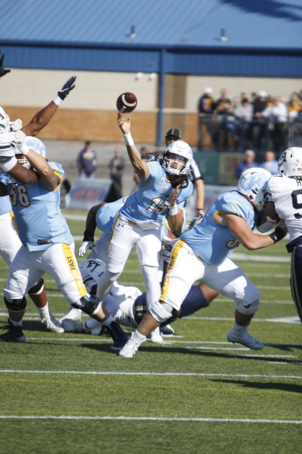 Kent State then-freshman quarterback Devin Kargman throws the ball as the Akron defense closes in at Dix Stadium Oct. 22.