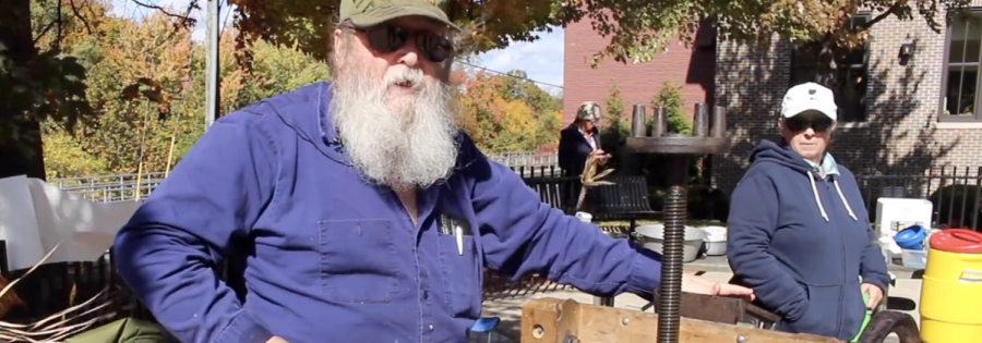 Mark Strickler demonstrates an old-fashioned cider press at the 17th Annual Cider Festival in downtown Kent Oct. 15, 2022.