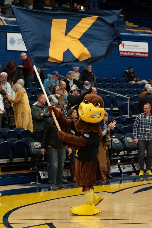 Flash the Golden Eagle waves a flag to celebrate the men's basketball team's victory over Portland University on Nov. 14, 2022.