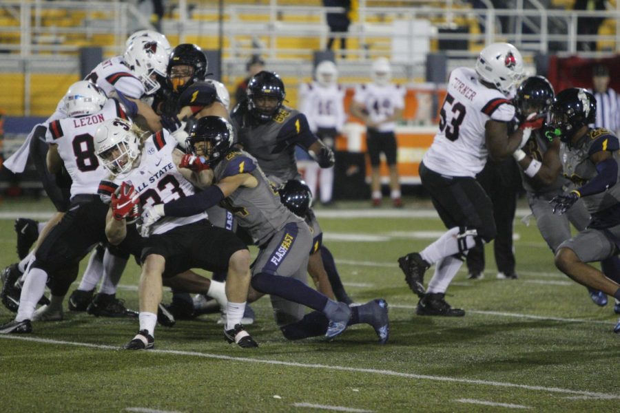 Kent State graduate student Nico Bolden takes down Ball State's Carson Steele during the game Nov. 2.