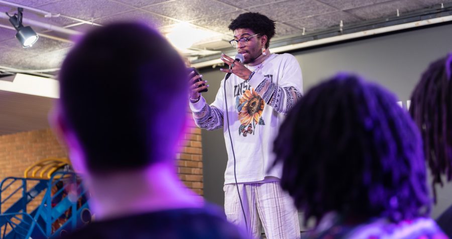 Tajuan Richards reads the crowd two poems that he wrote. During his set, the crowd was focused on him and clapped after the poetry was read.