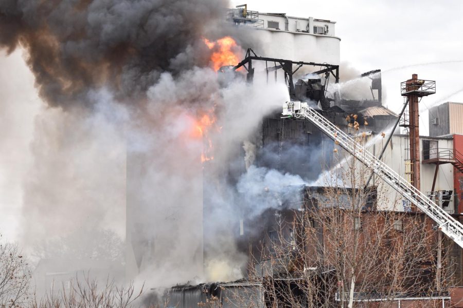 Smoke billows from the Star of the West Mill as firefighters work to put out the blaze.