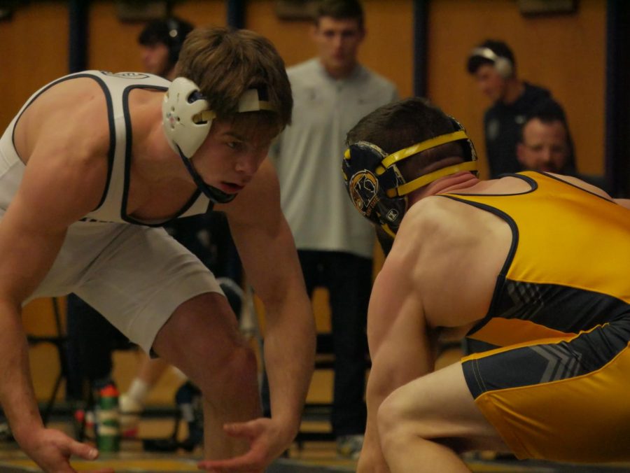 Kody Komara (Gold) squares off with Kyle Schickel (white) during Kent State's contest against Clarion Jan. 29.