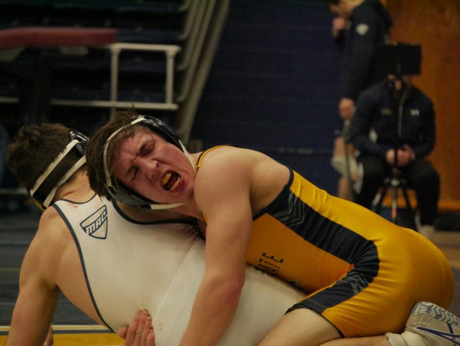 Keegan Knapp (Gold) cheers after regaining control from opponent Trevor Elfvin (White) during Kent State's matchup against Clarion Jan. 29, 2023.