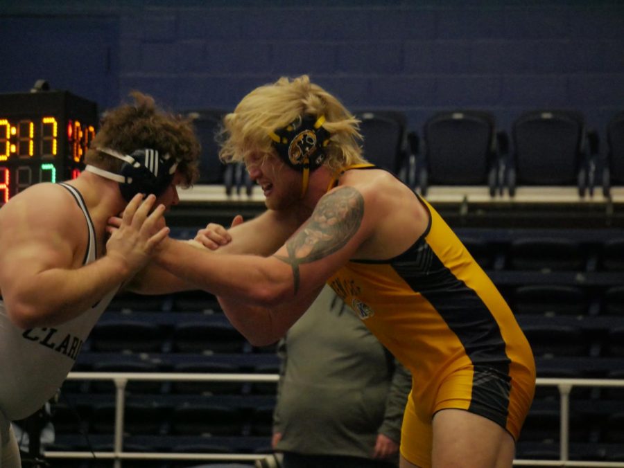 Jacob Cover (Gold) and Austin Chapman (White) during Kent State's matchup against Clarion on Jan. 29.