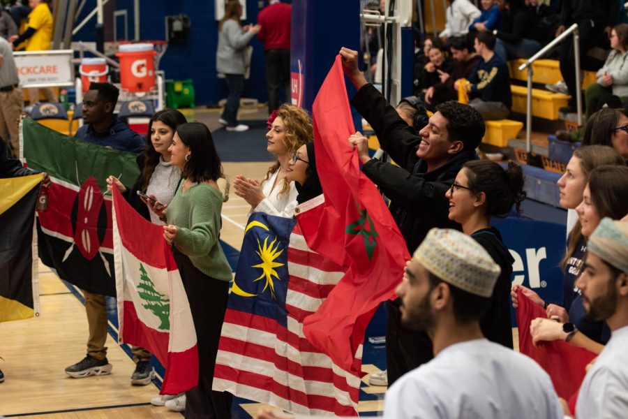 During the half-time of the Kent State men's basketball game against Central Michigan University, Kent State international students took to the court with flags of their home nations on Jan. 31, 2023. 