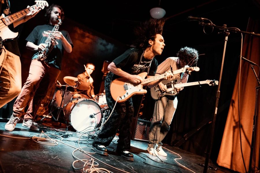 Junior psychology student Finn Mroz-Roakes played in his high school band called Snapping Turtlenecks.