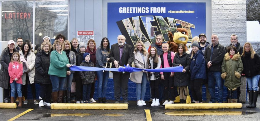 Maggie McKendy (right), Kent Mayor Jerry Fiala and Nicole Awad (left) cut the ribbon for the Kent's newest convenience store Campus Mart. The ceremony was held Jan. 14 at the store off Main Street. 