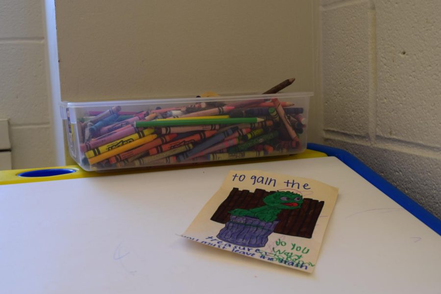 A drawing of Oscar the Grouch left at the children's desk on the sixth floor of the library after family-friendly library hours.