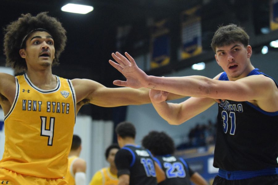 Kent State senior Chris Payton pushes away Buffalo University freshman Isaac Jack as he attempts to guard him during the home game on Jan. 27, 2023.