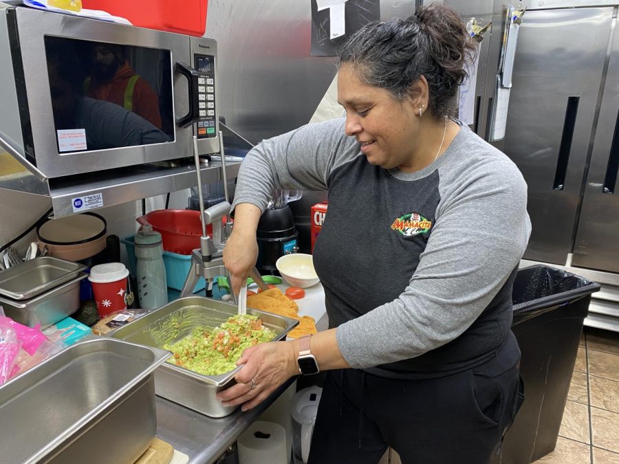 Monica Hally, owner of the new restaurant Mamacita's in Kent, prepares guacamole. She makes many ingredients fresh before opening every day. 