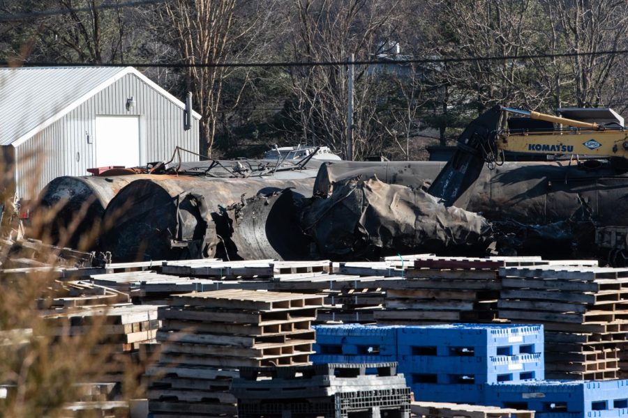 Clean-up crews work to remove debris from the Norfolk Southern derailment in East Palestine on Feb. 19, 2023.