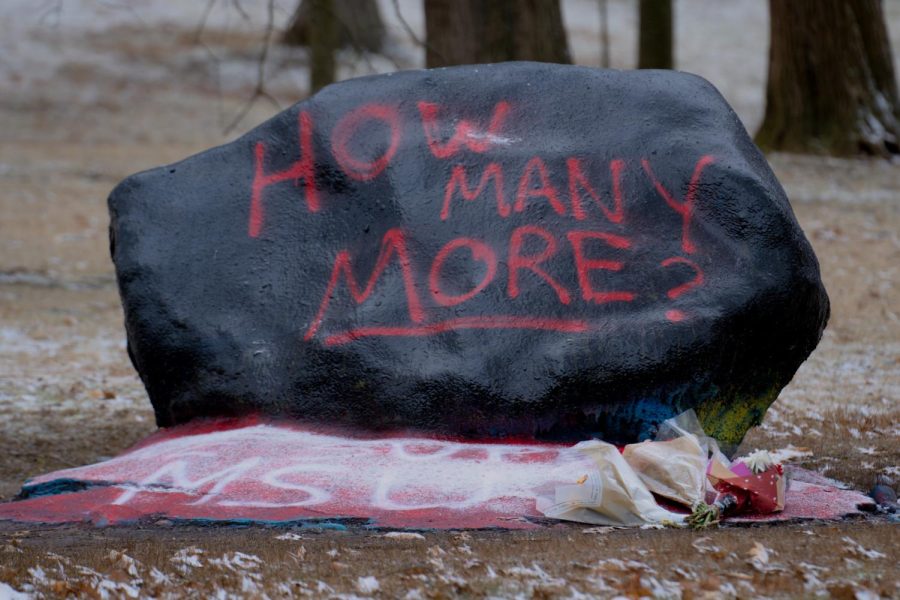 "How Many More" written on the face of Kent State's rock on front campus. The base of the rock is painted with the words, "We Support MSU" to honor the victims of the recent shooting at Michigan State University on Feb. 13, 2023. The photo was taken on Feb. 17, 2023.