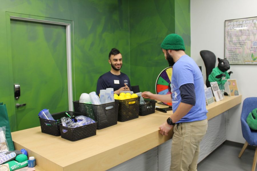 Students enjoying giveaway items at the opening of the Well Hub in the Student Recreation and Wellness Center Feb. 22, 2023.