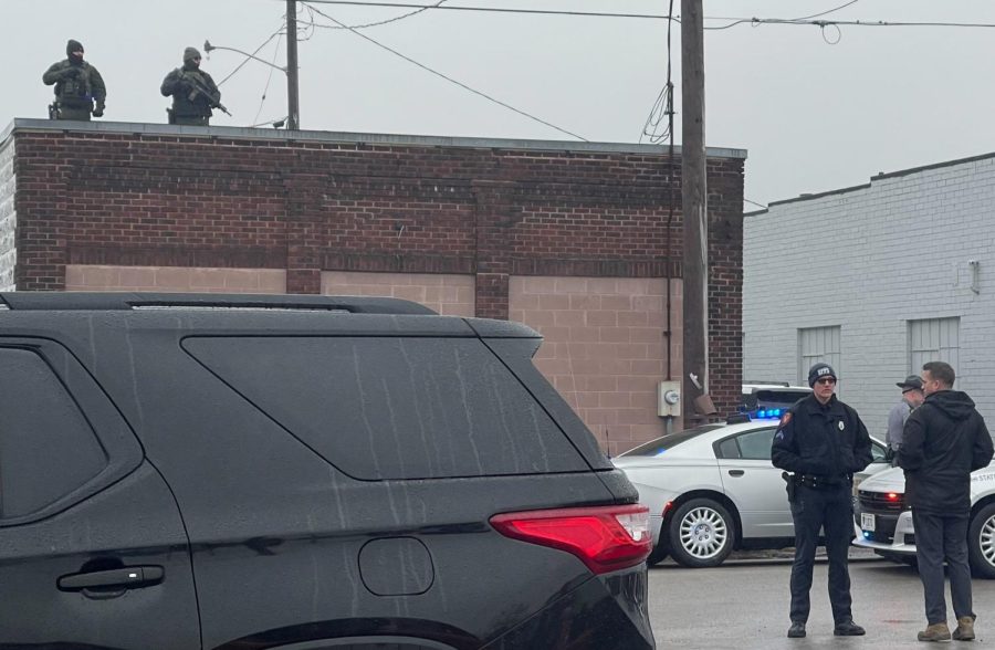 Snipers and East Palestine police stand on East Clark Street in East Palestine Feb. 22 as security measures for former president Donald Trump. Trump and his son, Donald Trump Jr., visited the city to address the Feb. 3 train derailment.