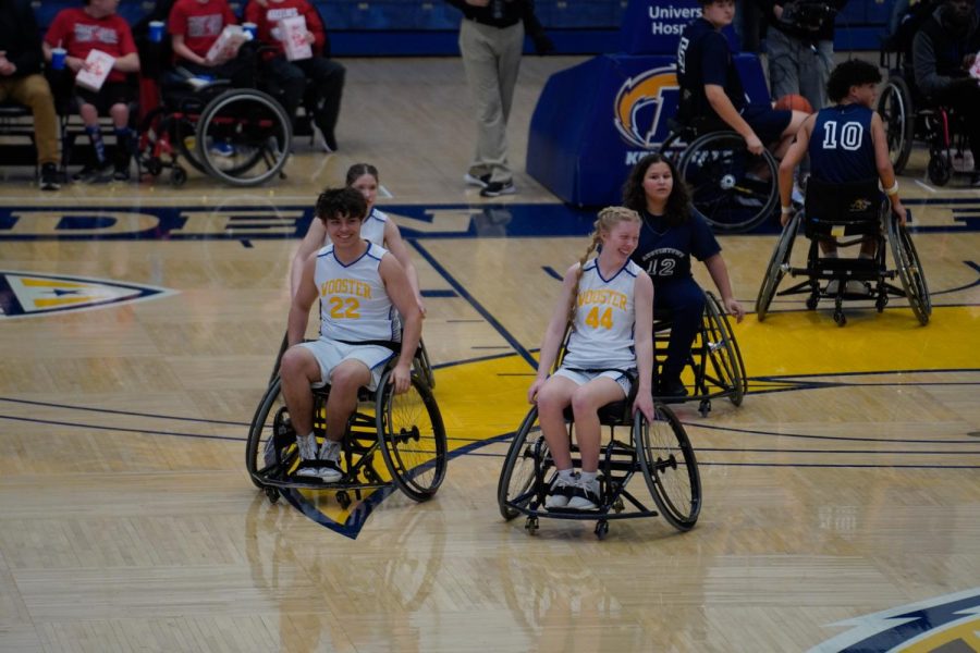 Wooster Wheelchair General's Austin Wilcox (left) and Madyson Followay (right) celebrate after scoring on Feb. 25, 2023.