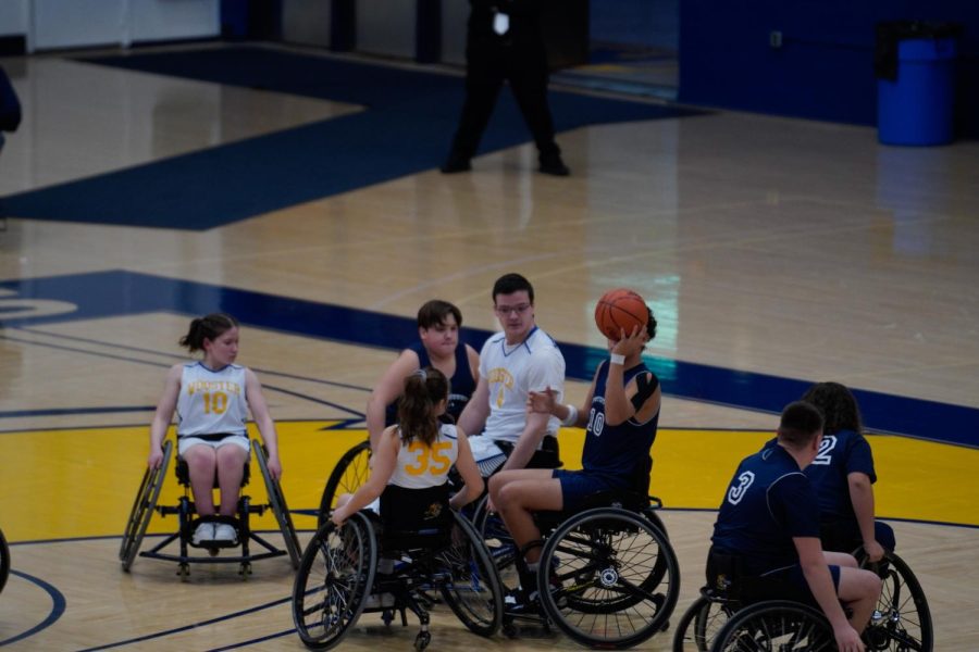 Franklin Nicola on the Austintown Wheelchair Falcons searches for someone to pass the ball to on Feb. 25, 2023. 