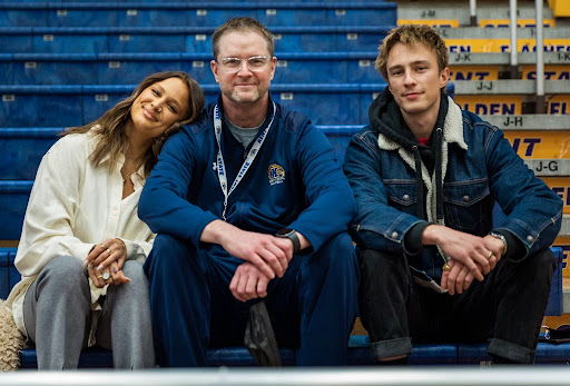 Coach Starkey poses with his son, Drew, and daughter, Brooke, during a basketball practice in Kent State's M.A.C. Center. Brooke graduated from Kent State in 2021.