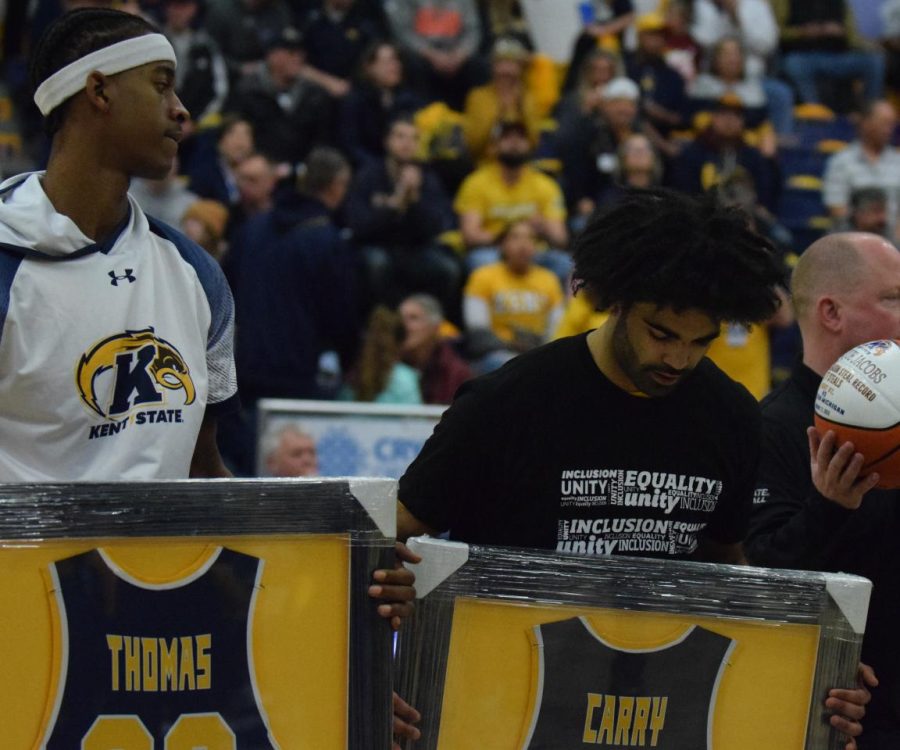 Kent Sate Seniors Miryne Thomas and Sincere Carry observe the gifts they received at their senior night game on March 3, 2023. 