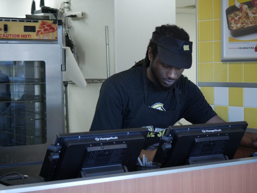 Sam Smith scanning the register at Hungry Howie's, located at 1444 E Main St, Kent, OH 44240.