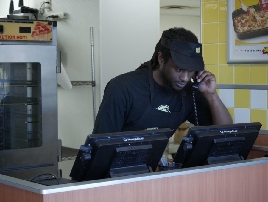 Sam Smith on the phone at Hungry Howie's, located at 1444 E Main St, Kent, OH 44240.