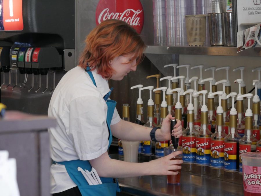 Ashley Nolan making a drink at the Wild Goats Cafe, located at 319 W Main St, Kent, OH 44240.