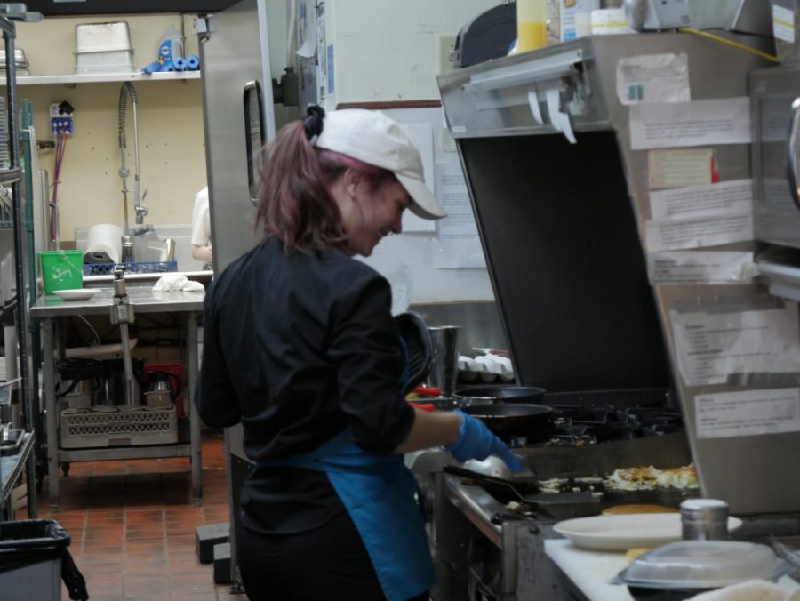 Carrie Carpenter smiles while flipping flapjacks at the Wild Goats Cafe, located at 319 W Main St, Kent, OH 44240.