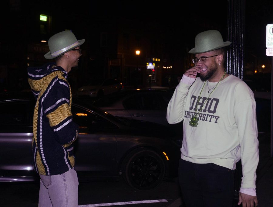 Mychal Wicker (left) and Cameron Subbs (right) wait outside Bar 157 to continue the festivities of Kent's Fake Paddy's Day Celebration Mar. 11.