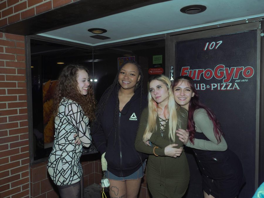 Deidre Keener (left), Renasia Waller (center left), Maria Hanshaw (center right), and Tori Hanshaw (right) wait outside EuroGyro during Kent's Fake Paddy's Day Celebration Mar. 11.