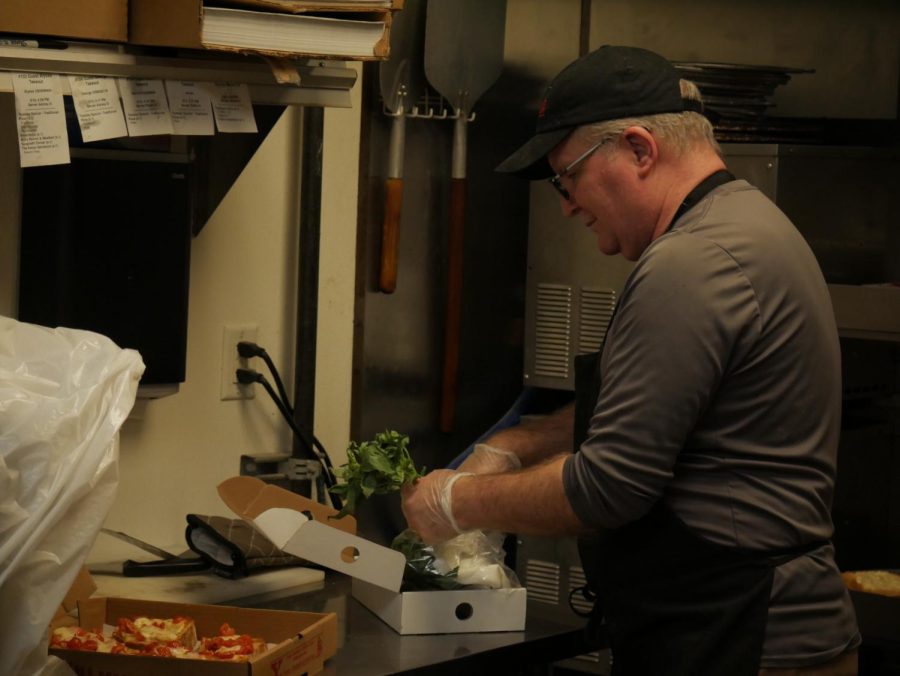 Belleria owner Tom Gavozzi gets ready for dinnertime service at Belleria. The restaurant is located at 135 E. Erie St. 