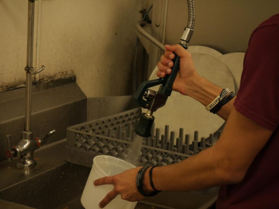 Ryan Babb washing dishes at Belleria, located at 135 E Erie St #202, Kent OH 44240.