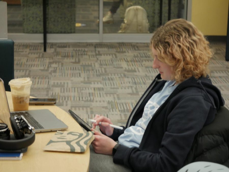 Julie Gaetano enjoying her coffee and getting work done at the Kent State Library, located at 1125 Risman Dr, Kent, OH 44242.