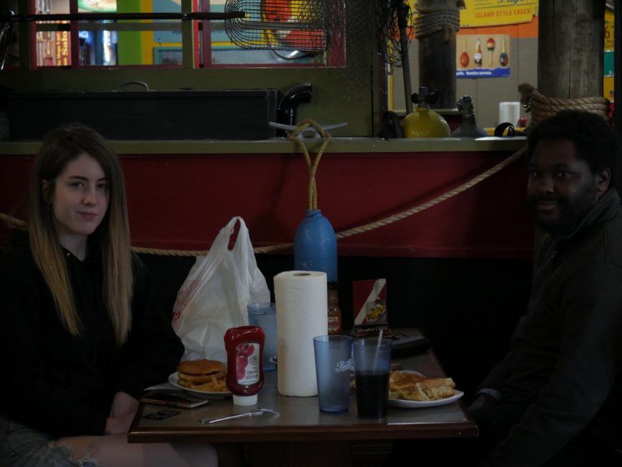 Cassandra Keegan (left) and Adam Cook (right) eat at Mike’s Place, located at 1700 S. Water St. 