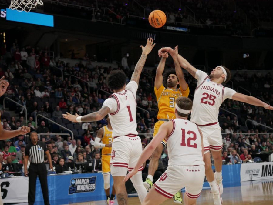 Sincere Carry (center right) attempts to get a 2-point-shot past three Indiana defenders at Kent State's March Madness matchup against Indiana Mar. 17.