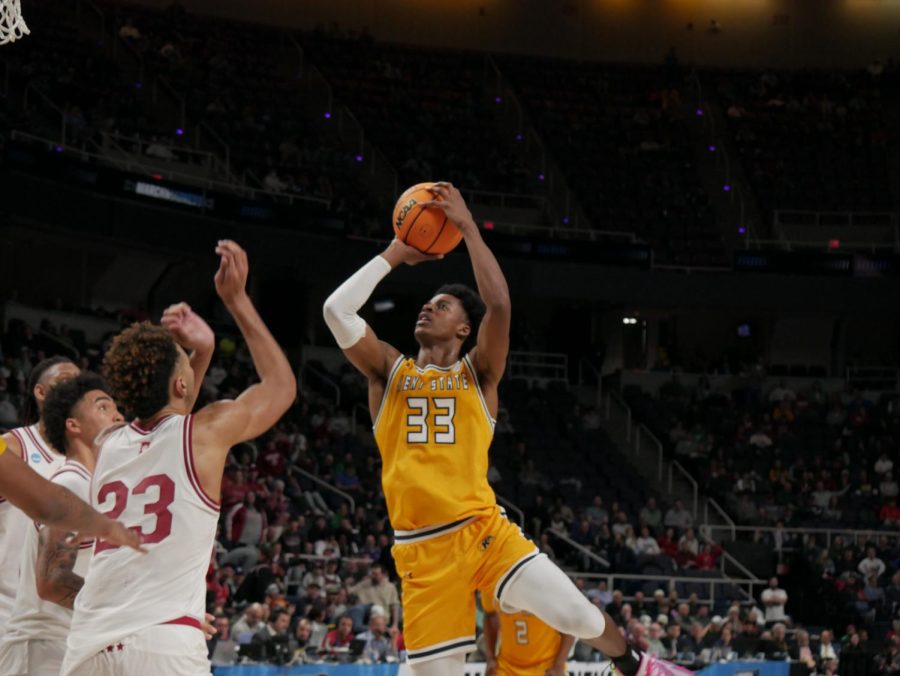 Miryne Thomas (center) attempts a 2-point-shot over Trayce Jackson-Davis (left) and a slew of defenders at Kent State's March Madness matchup against Indiana Mar. 17.