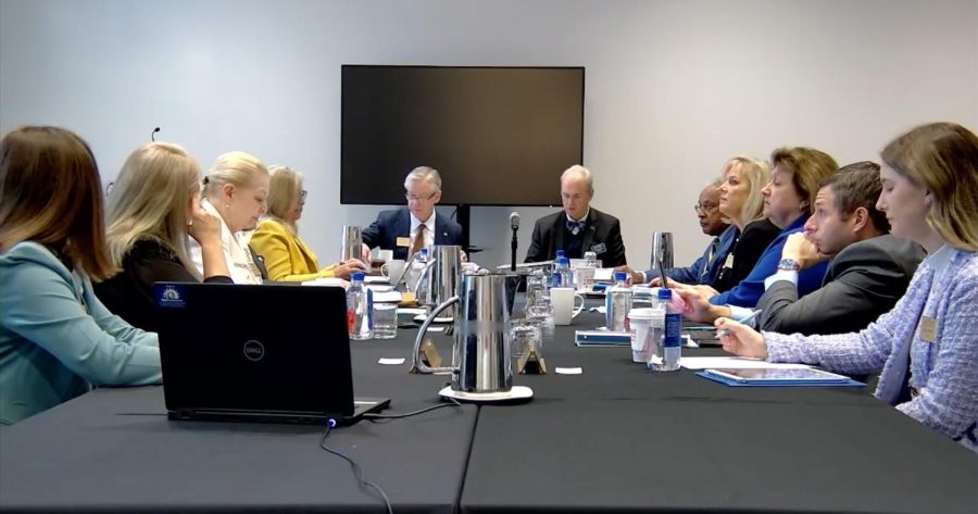 Chair John Riley (center left) and President Todd Diacon (center right) preside over The Kent State Board of Trustees meeting March 9, 2023.