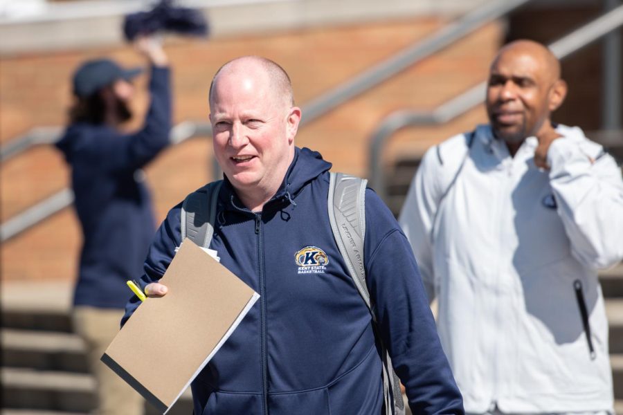 Men's basketball coach Rob Senderoff smiles at the gathered crowd as he heads down to the buses from the MAAC as the team heads to New York for the NCAA tournament March 15, 2023.