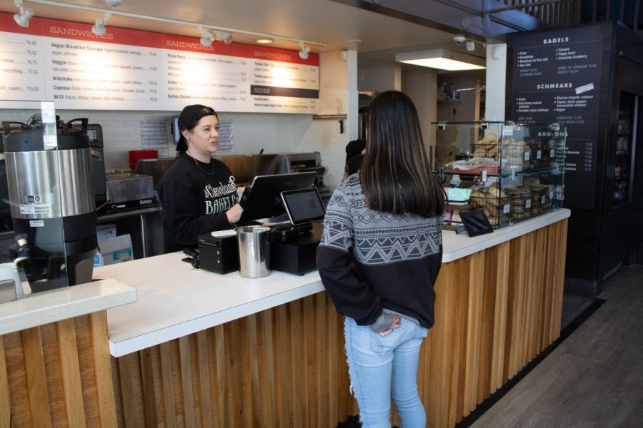 Freshman photography major Abigail Burkhardt orders at Cleveland Bagel Cafe March 15. Cleveland Bagel Cafe is located at 436 E. Main St.