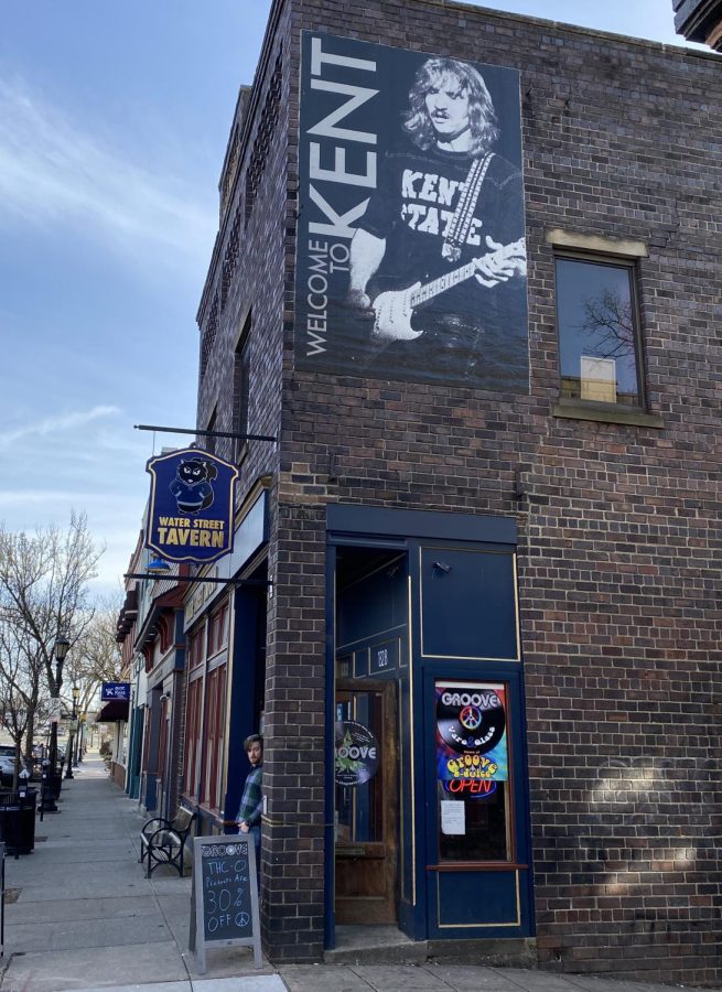 A man walks out of Water Street Tavern in downtown Kent. Cam said BORGs are a cheaper alternative to going out and drinking at bars.