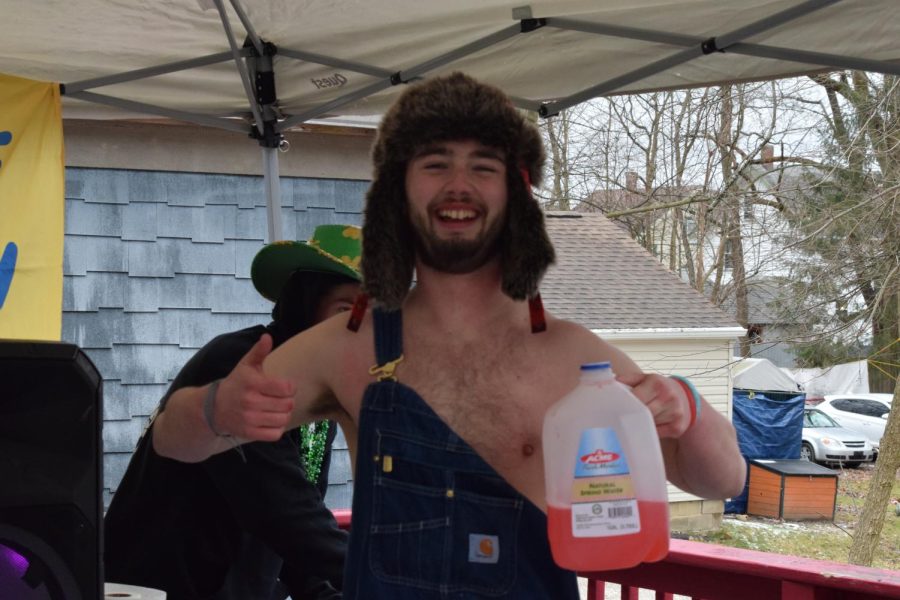 JD Lancaster parties at TKE with overalls and a BORG, trying to stay warm while he celebrates Kent State's Fake Paddy's Day March 11, 2023.