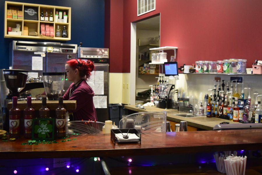 A worker makes coffee for customers at Tree City Coffee & Pastry, located in Acorn Alley at 135 E. Erie St., which placed second for “Best Coffee Shop.”