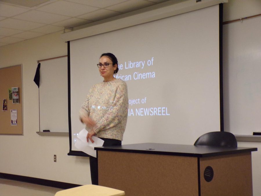 Ikram Toumi, associate professor of communications studies, about to present African movie night.