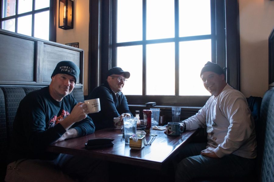 Kent firefighter Gary Lane (left) and his friends Nate Miller (middle) and Troy Acker (right) enjoy breakfast at Over Easy March 15. Over Easy received several Best of Kent nominations and is located at 152 Franklin Avenue.