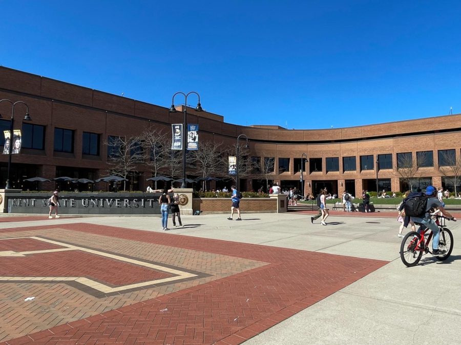 Kent State University's campus is alive with students on a warm day.