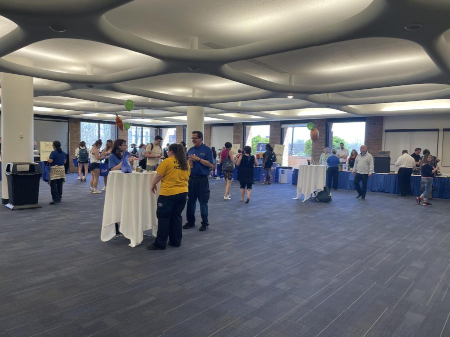 Students, faculty, staff and community members check out different vendors at Good Food, Better Earth.