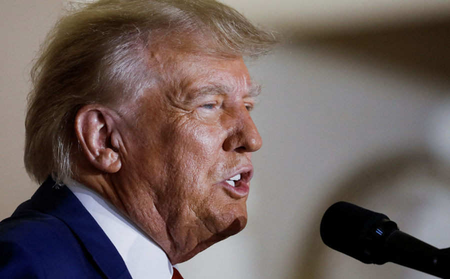 Former US President Donald Trump delivers remarks in Palm Beach, Florida, on the day of his court appearance in New York after being indicted on Tuesday. (Marco Bello/Reuters)
