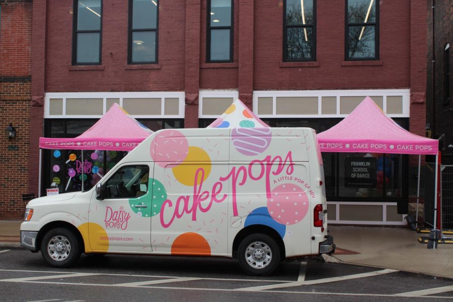 Daisy Pops' cake popped-themed van parked in front of the shop for its grand opening April 28, 2023. This was day one of a two day grand opening.