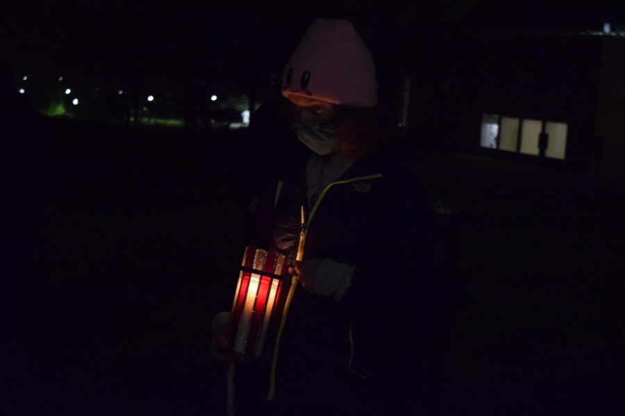 Kent State Student holds a candle in memory of one of four students shot and killed by the national guard May 4, 1970.