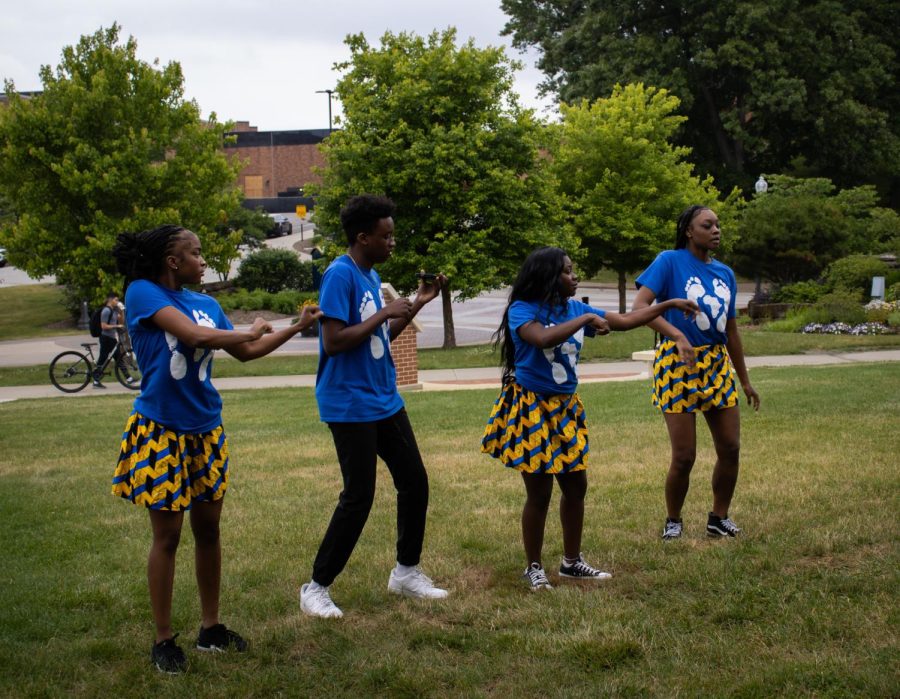 Members, Blair Seu, Nora Sone, Hayden Wilks-Mitchell, and Mikayla Perryman of Barefeet Dance Tribe rehearse before performing at Kent State's Juneteenth celebration.